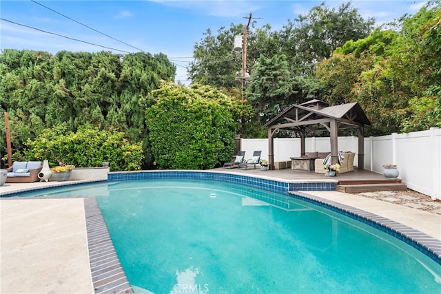 1161 Ravencrest Rd, North Tustin, CA 92705 - view of pool featuring a gazebo, an outdoor hangout area, a fenced backyard, a wooden deck, and a patio area
