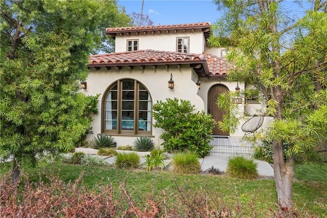1538 N Stanley Ave, Los Angeles, CA 90046 - rear view of property featuring a tile roof and stucco siding