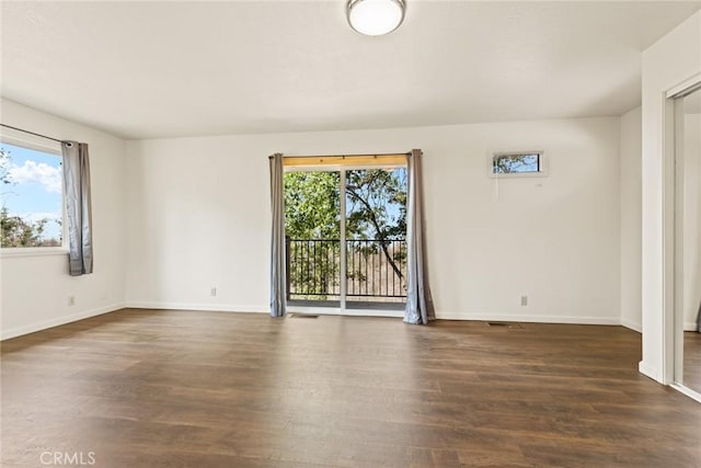 490 Vilas Rd, Chico, CA 95973 - empty room featuring plenty of natural light, wood finished floors, and baseboards