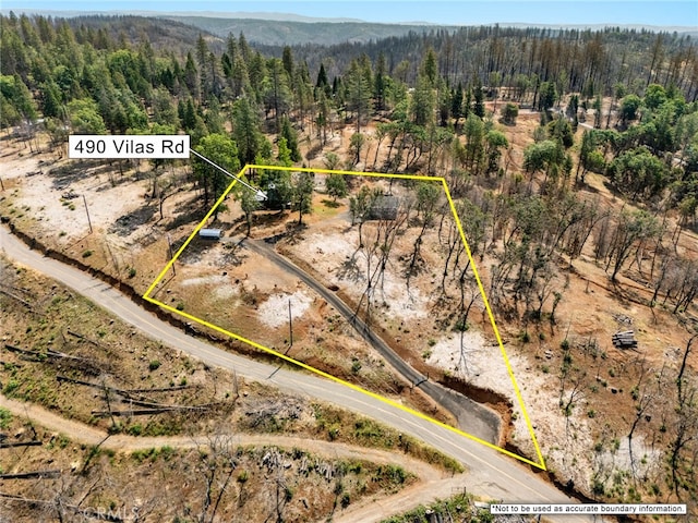 490 Vilas Rd, Chico, CA 95973 - aerial view of property and surrounding area featuring a heavily wooded area and property boundaries highlighted
