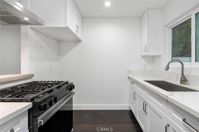217 43rd St, Manhattan Beach, CA 90266 - kitchen with black range with gas stovetop, a sink, exhaust hood, baseboards, and recessed lighting