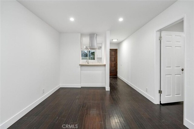 217 43rd St, Manhattan Beach, CA 90266 - unfurnished living room with dark wood-style floors, baseboards, and recessed lighting