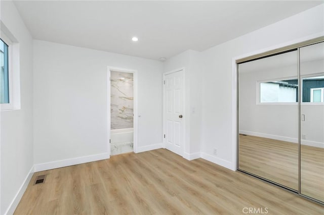 217 43rd St, Manhattan Beach, CA 90266 - unfurnished bedroom with light wood finished floors, baseboards, recessed lighting, a closet, and connected bathroom