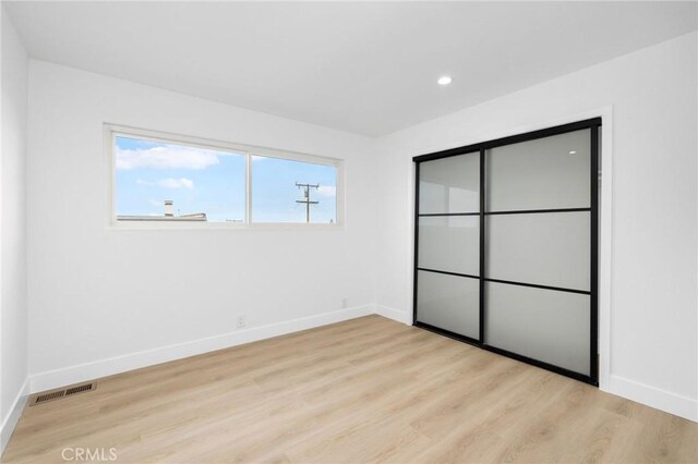217 43rd St, Manhattan Beach, CA 90266 - unfurnished bedroom featuring baseboards, wood finished floors, and recessed lighting