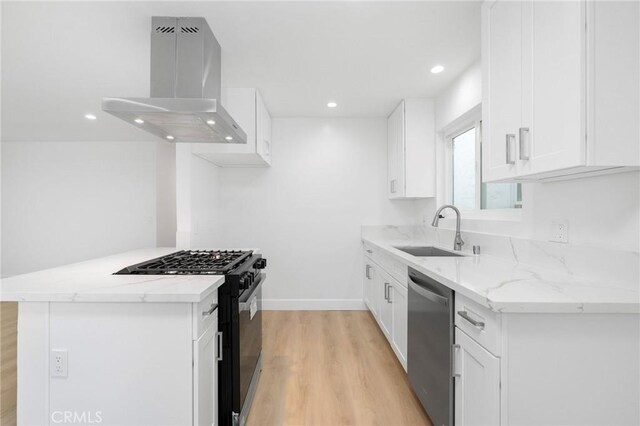 217 43rd St, Manhattan Beach, CA 90266 - kitchen featuring island range hood, dishwasher, black gas range oven, a sink, and light wood finished floors