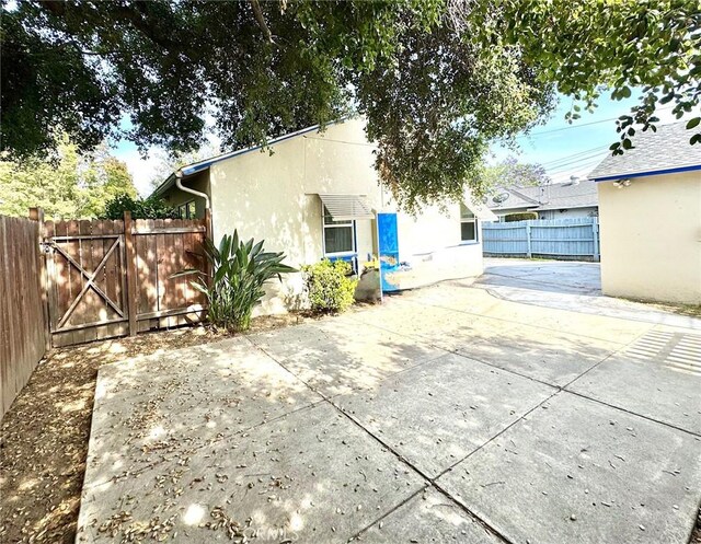 823 N Santa Anita Ave N, Arcadia, CA 91006 - back of property featuring stucco siding and a patio