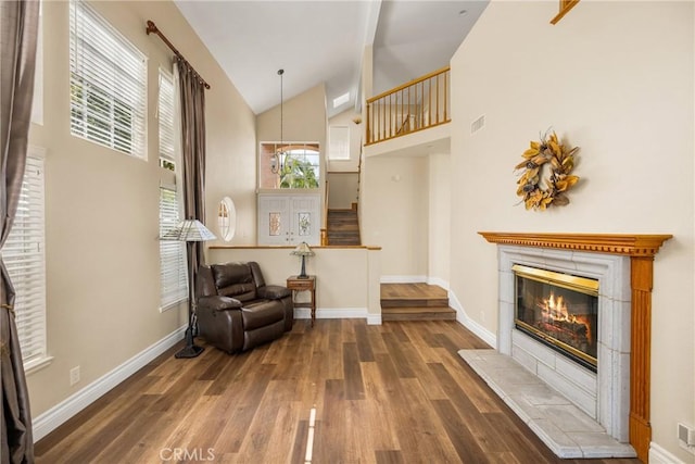 24952 Eaton Ln, Laguna Niguel, CA 92677 - living area featuring wood finished floors, a fireplace, and high vaulted ceiling