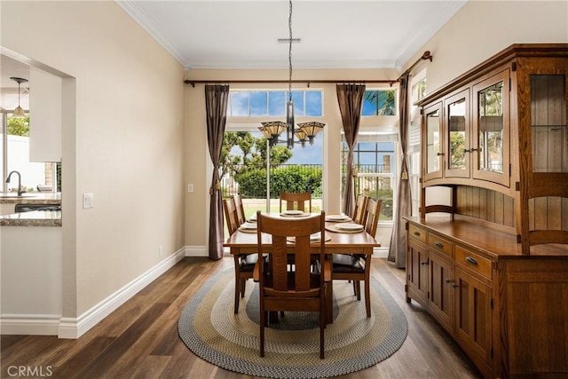 24952 Eaton Ln, Laguna Niguel, CA 92677 - dining space featuring a chandelier, dark wood finished floors, and crown molding