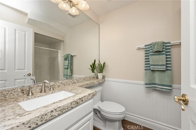 24952 Eaton Ln, Laguna Niguel, CA 92677 - full bathroom featuring vanity, wainscoting, and a shower