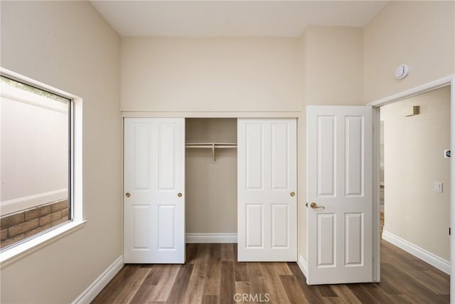 24952 Eaton Ln, Laguna Niguel, CA 92677 - unfurnished bedroom with dark wood-type flooring and a closet