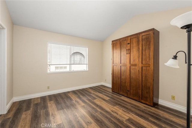 24952 Eaton Ln, Laguna Niguel, CA 92677 - unfurnished bedroom featuring dark wood-style floors and vaulted ceiling