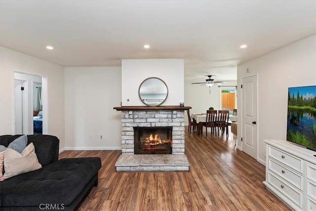 22554 Pico St, Grand Terrace, CA 92313 - living room with wood finished floors, baseboards, ceiling fan, recessed lighting, and a warm lit fireplace