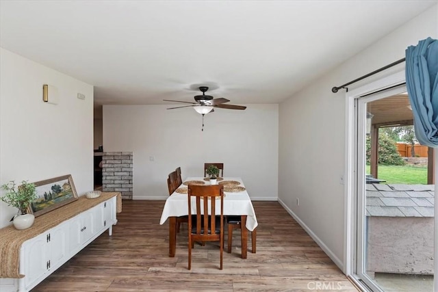 22554 Pico St, Grand Terrace, CA 92313 - dining area featuring light wood finished floors, a ceiling fan, baseboards, and a brick fireplace