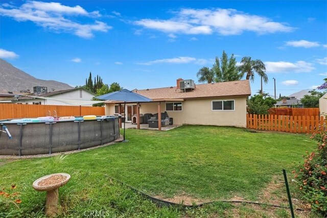 22554 Pico St, Grand Terrace, CA 92313 - back of house with stucco siding and a patio area