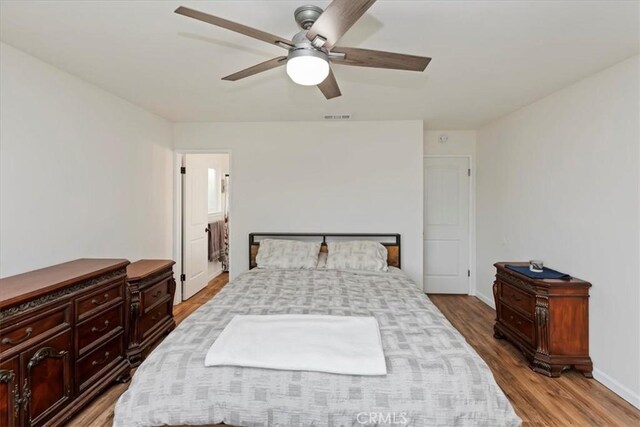 22554 Pico St, Grand Terrace, CA 92313 - bedroom with wood finished floors, baseboards, and a ceiling fan