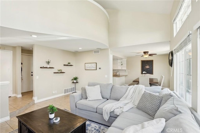 1 Buttercup Unit 42, Rancho Santa Margarita, CA 92688 - living area with a towering ceiling, light tile patterned floors, ceiling fan, and recessed lighting