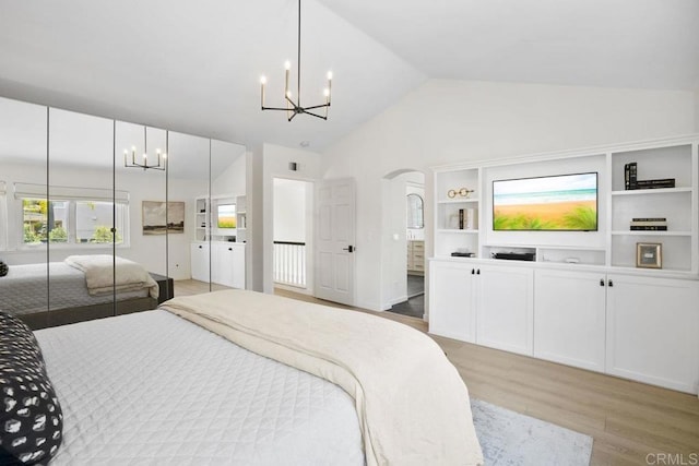 5233 Belardo Dr, San Diego, CA 92124 - bedroom featuring a chandelier, light wood finished floors, high vaulted ceiling, and arched walkways