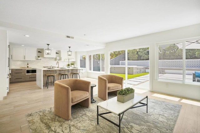 5233 Belardo Dr, San Diego, CA 92124 - living area with light wood-type flooring and recessed lighting