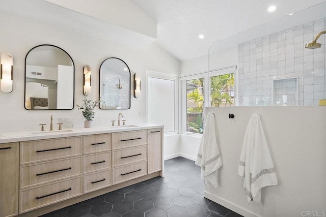 5233 Belardo Dr, San Diego, CA 92124 - bathroom with vaulted ceiling, double vanity, recessed lighting, tile patterned floors, and a tile shower