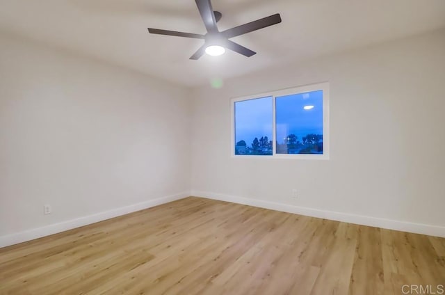 3776 Enero Ct, San Diego, CA 92154 - unfurnished room with baseboards, a ceiling fan, and light wood-style floors