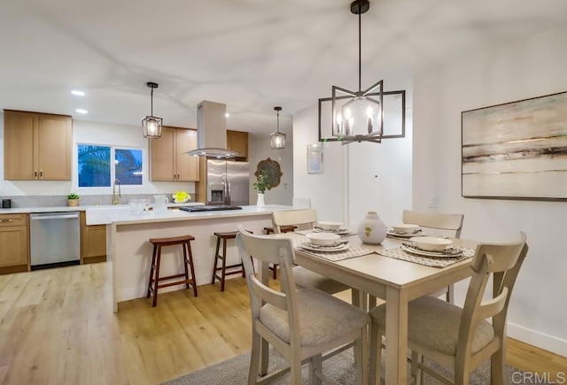 3776 Enero Ct, San Diego, CA 92154 - dining area with light wood-type flooring, recessed lighting, baseboards, and a chandelier