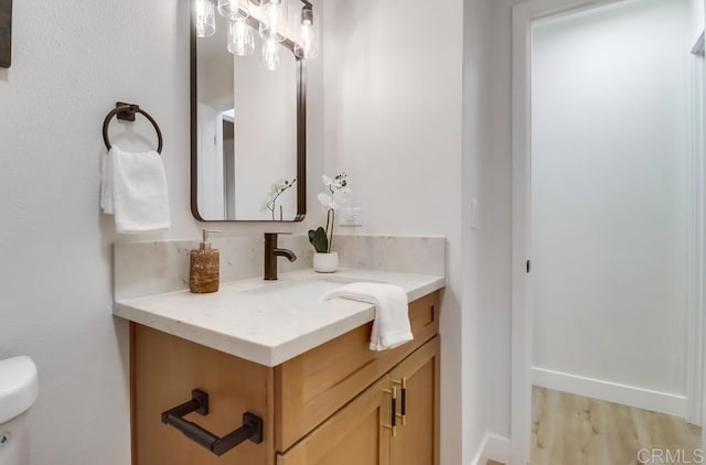 3776 Enero Ct, San Diego, CA 92154 - bathroom featuring vanity, toilet, and wood finished floors