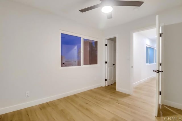 3776 Enero Ct, San Diego, CA 92154 - spare room featuring a ceiling fan, light wood-type flooring, and baseboards