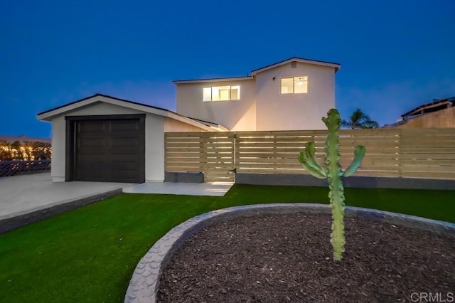 3776 Enero Ct, San Diego, CA 92154 - back of house at twilight with stucco siding and an attached garage