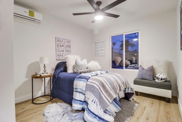 3776 Enero Ct, San Diego, CA 92154 - bedroom featuring a wall mounted air conditioner, wood finished floors, baseboards, and ceiling fan