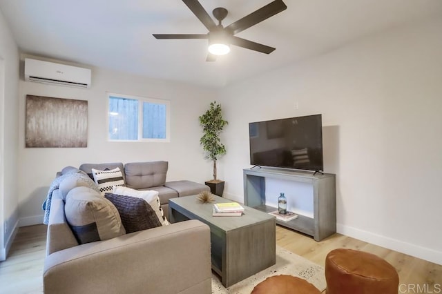3776 Enero Ct, San Diego, CA 92154 - living area with a wall unit AC, a ceiling fan, baseboards, and light wood-style floors