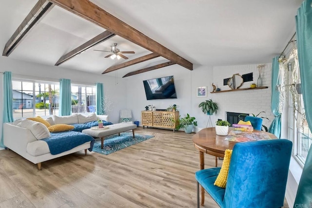 2581 Meadow Lark Dr, San Diego, CA 92123 - living area with wood finished floors, ceiling fan, and beam ceiling