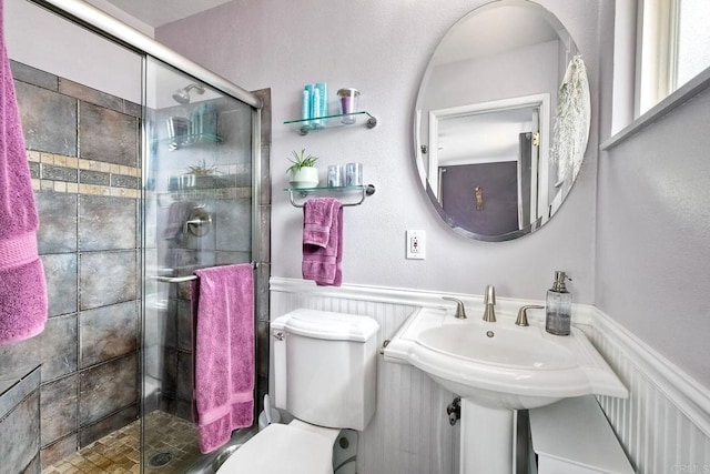 2581 Meadow Lark Dr, San Diego, CA 92123 - bathroom featuring a stall shower and a wainscoted wall