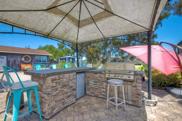 2581 Meadow Lark Dr, San Diego, CA 92123 - view of patio / terrace with exterior kitchen