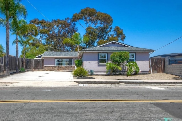 2581 Meadow Lark Dr, San Diego, CA 92123 - ranch-style house with stucco siding, stone siding, and concrete driveway