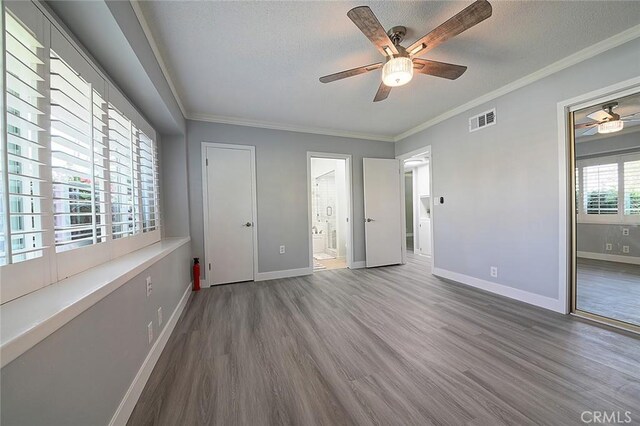 11471 Gill Dr, Garden Grove, CA 92841 - unfurnished bedroom featuring wood finished floors, a textured ceiling, crown molding, connected bathroom, and a ceiling fan