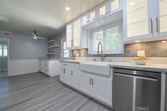 11471 Gill Dr, Garden Grove, CA 92841 - kitchen featuring dishwasher, healthy amount of natural light, a ceiling fan, white cabinets, and wainscoting