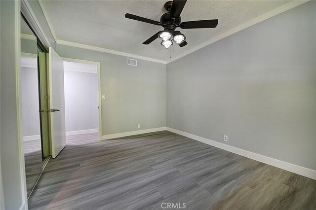 11471 Gill Dr, Garden Grove, CA 92841 - spare room featuring a textured ceiling, ceiling fan, wood finished floors, and crown molding
