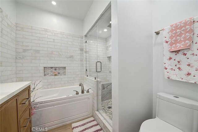 11471 Gill Dr, Garden Grove, CA 92841 - bathroom featuring a bath, vanity, a shower stall, recessed lighting, and wood finished floors