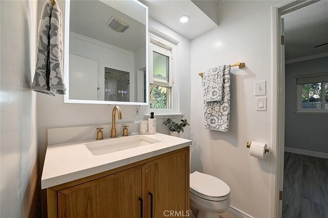 11471 Gill Dr, Garden Grove, CA 92841 - bathroom featuring ornamental molding, vanity, and wood finished floors