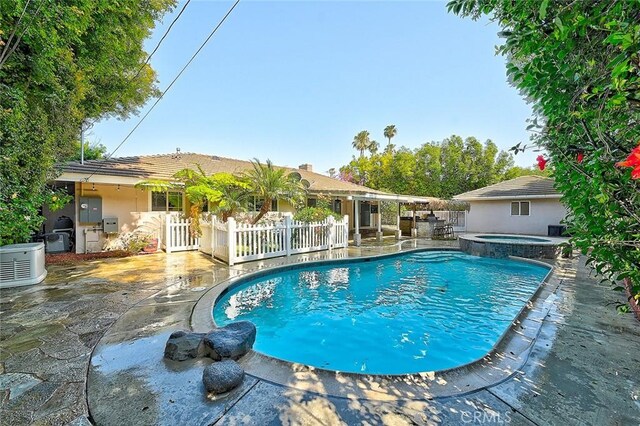 11471 Gill Dr, Garden Grove, CA 92841 - view of swimming pool with a patio and a pool with connected hot tub