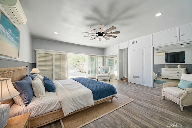 11471 Gill Dr, Garden Grove, CA 92841 - bedroom featuring a wall mounted air conditioner, wood finished floors, recessed lighting, and ceiling fan