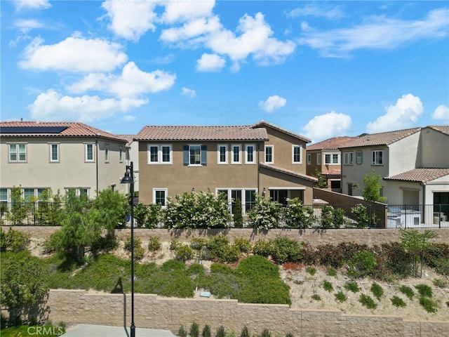 20748 Beech Cir, Porter Ranch, CA 91311 - back of property with stucco siding, a tile roof, and a residential view