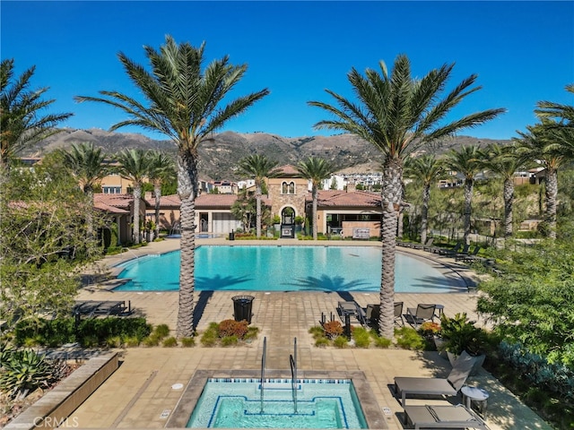 20748 Beech Cir, Porter Ranch, CA 91311 - community pool with a mountain view and a patio area