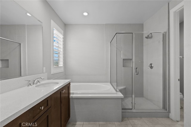 20748 Beech Cir, Porter Ranch, CA 91311 - bathroom with vanity, a garden tub, a shower stall, toilet, and tile patterned floors