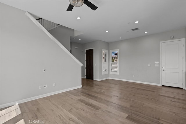 20748 Beech Cir, Porter Ranch, CA 91311 - unfurnished living room featuring a ceiling fan, stairs, wood finished floors, baseboards, and recessed lighting