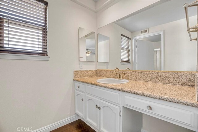 19554 Crystal Ridge Ln, Porter Ranch, CA 91326 - bathroom featuring vanity, healthy amount of natural light, ceiling fan, and baseboards
