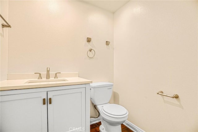 19554 Crystal Ridge Ln, Porter Ranch, CA 91326 - half bath with toilet, vanity, baseboards, and wood finished floors