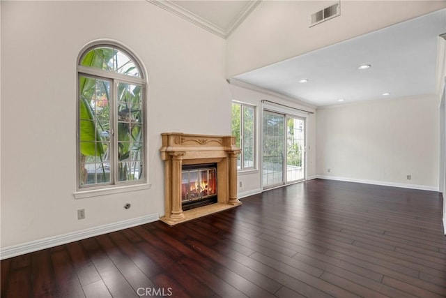 19554 Crystal Ridge Ln, Porter Ranch, CA 91326 - unfurnished living room featuring healthy amount of natural light, crown molding, a glass covered fireplace, hardwood / wood-style floors, and baseboards