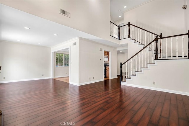 19554 Crystal Ridge Ln, Porter Ranch, CA 91326 - unfurnished living room with wood finished floors, stairway, baseboards, a towering ceiling, and recessed lighting