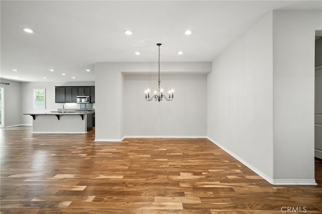35414 Laurel Tree Ct, Winchester, CA 92596 - unfurnished dining area featuring recessed lighting, a chandelier, and wood finished floors